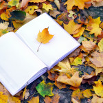 book with leaves in background