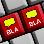 Red Computer keyboard with two speech bubble showing bla bla