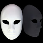 White mask with reflection on black background
