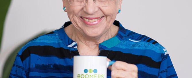Joyce Feustel holding her logo mug
